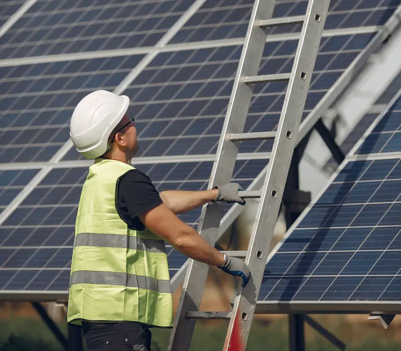 man-with-white-helmet-near-solar-panel (1)